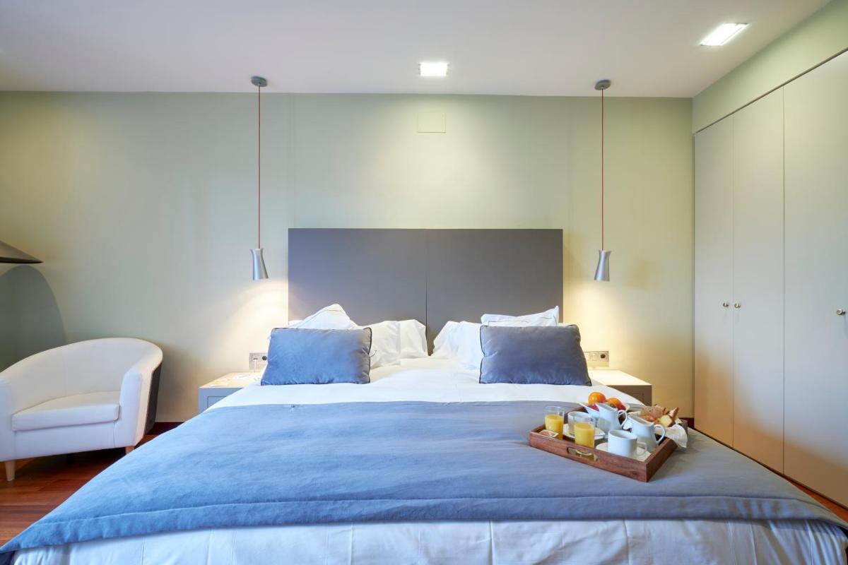 Cama o camas de una habitación en Hotel AR Isabel de Farnesio
