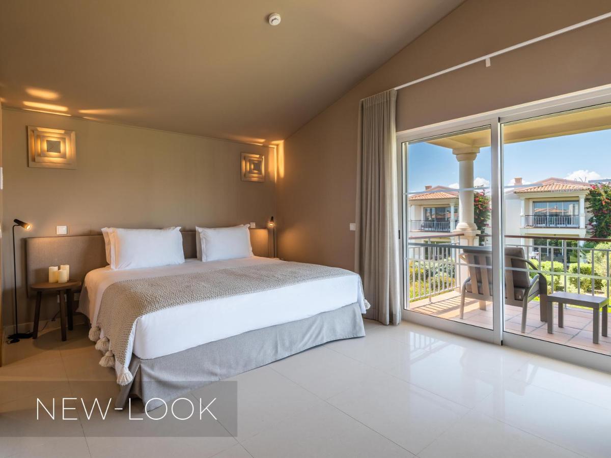 Uma cama ou camas num quarto em Vale da Lapa Village Resort