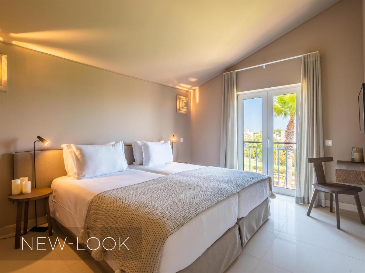 Uma cama ou camas num quarto em Vale da Lapa Village Resort