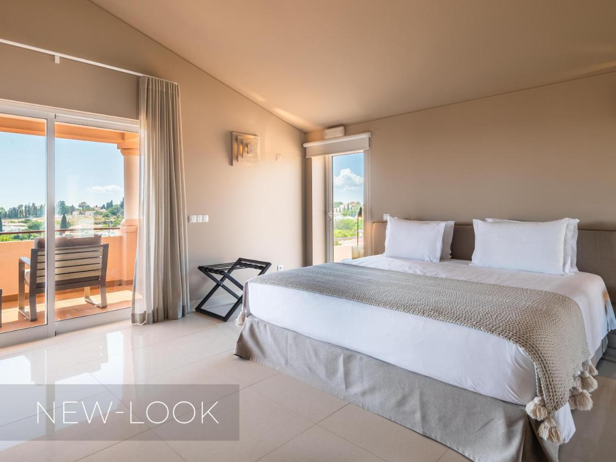 Uma cama ou camas num quarto em Vale da Lapa Village Resort