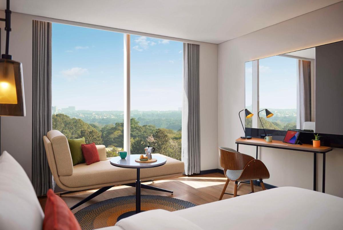 a hotel room with a view of a room at Hyatt Centric Hebbal Bengaluru in Bengaluru