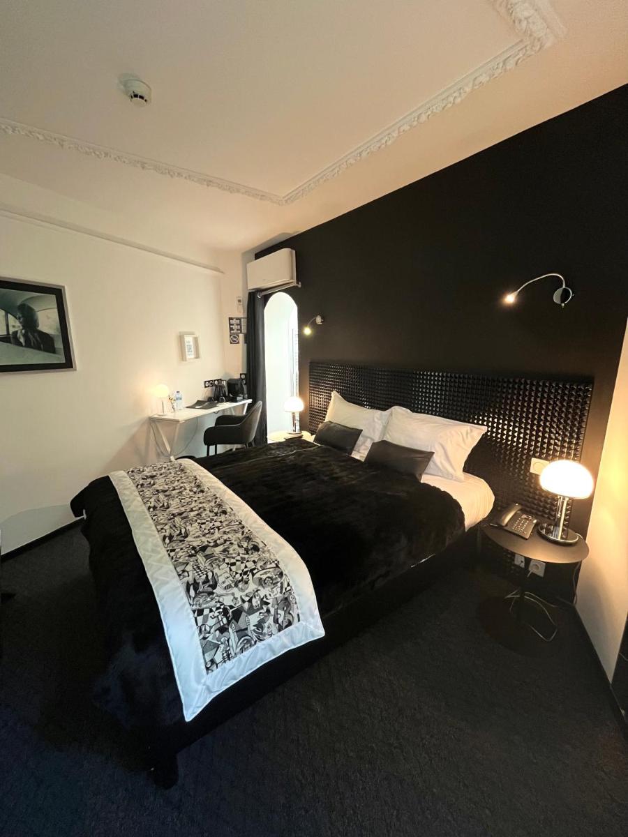 Un ou plusieurs lits dans un hébergement de l'établissement Art Hotel