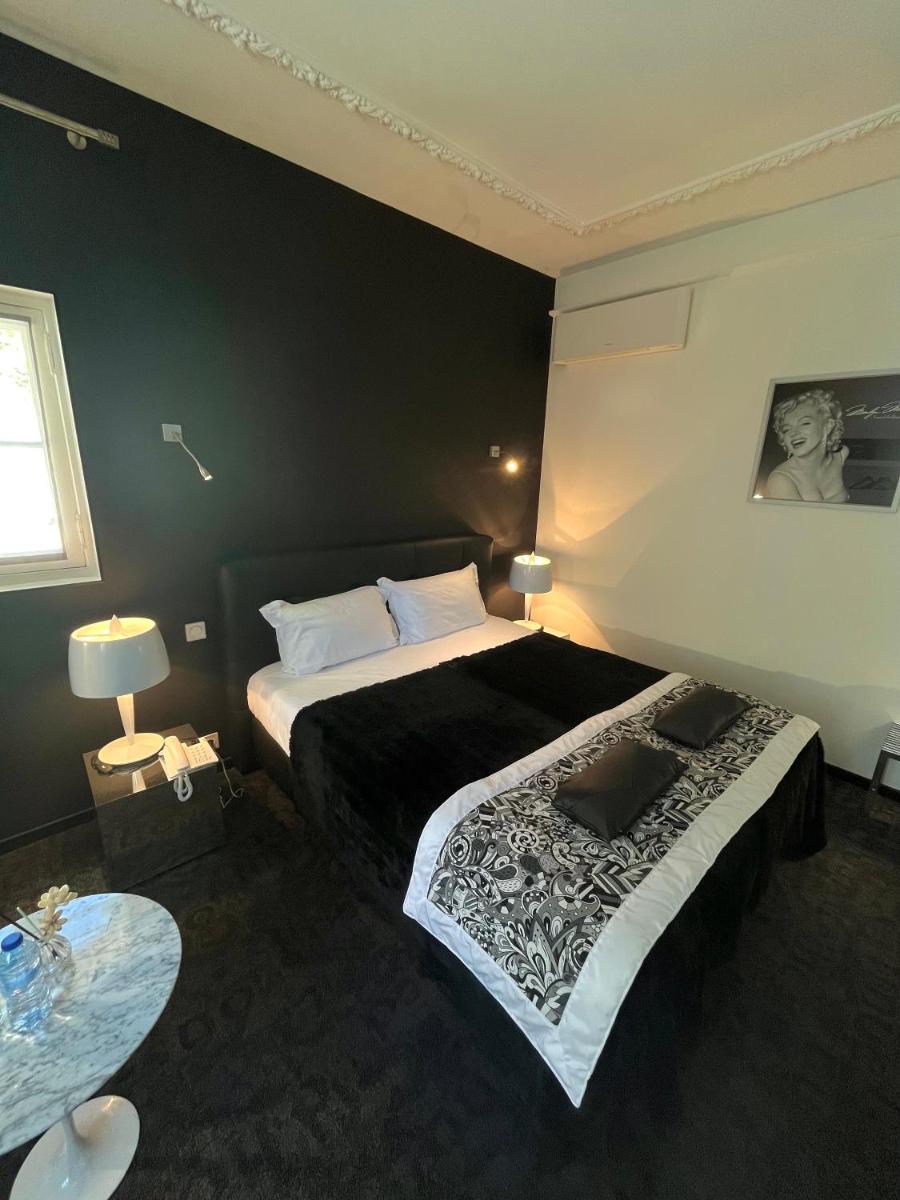 Un ou plusieurs lits dans un hébergement de l'établissement Art Hotel