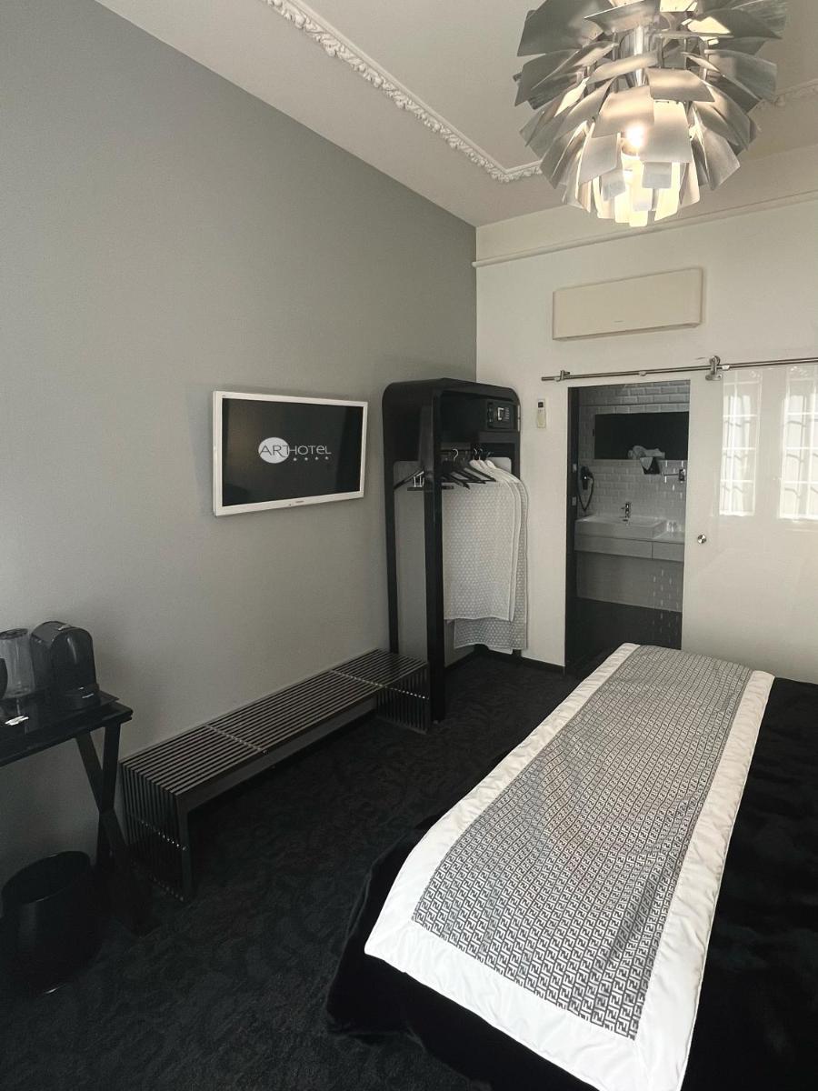 Un ou plusieurs lits dans un hébergement de l'établissement Art Hotel