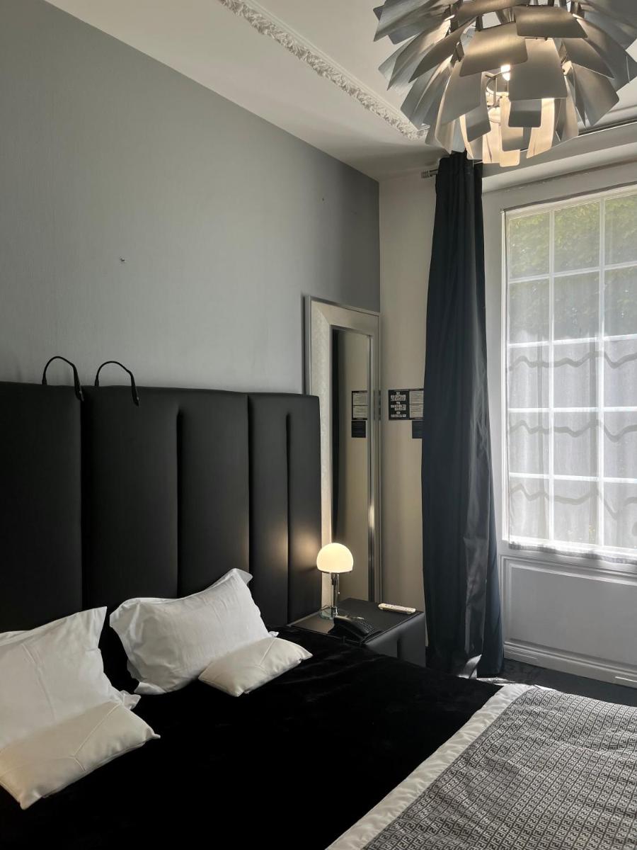 Un ou plusieurs lits dans un hébergement de l'établissement Art Hotel