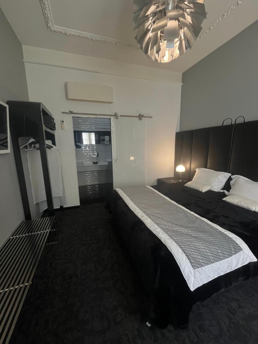 Un ou plusieurs lits dans un hébergement de l'établissement Art Hotel