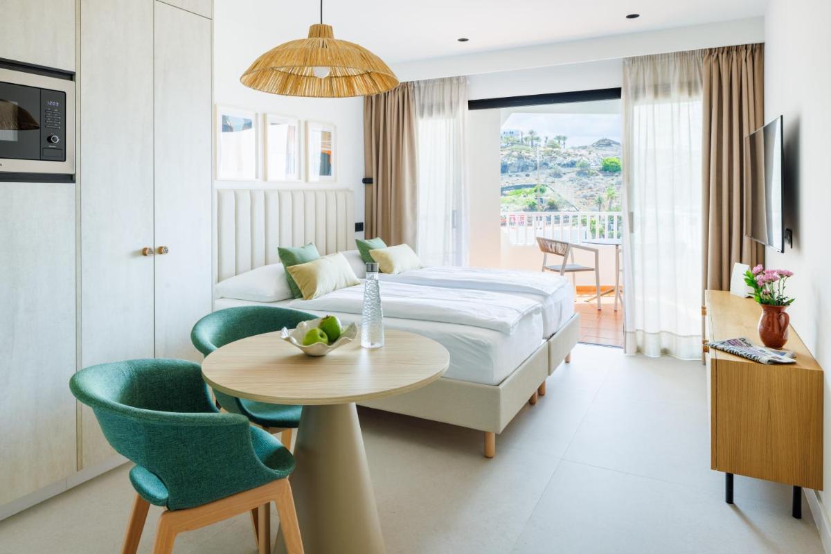 Cama o camas de una habitación en Hapimag San Agustín