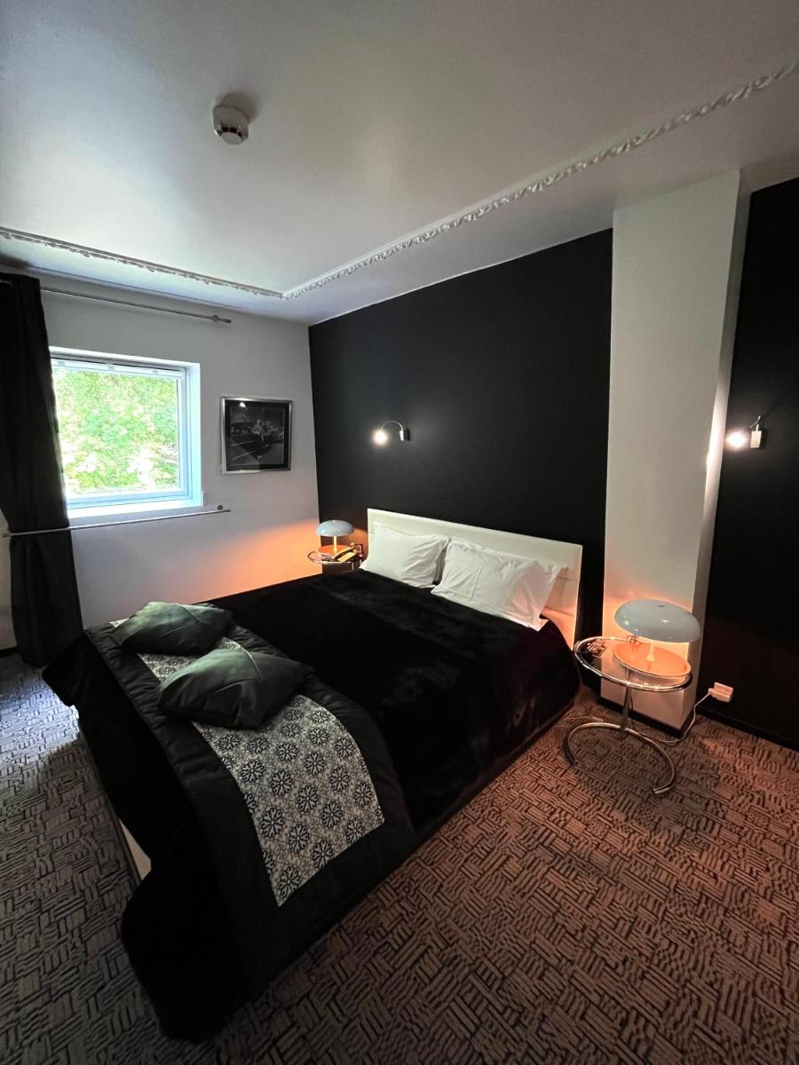 Un ou plusieurs lits dans un hébergement de l'établissement Art Hotel