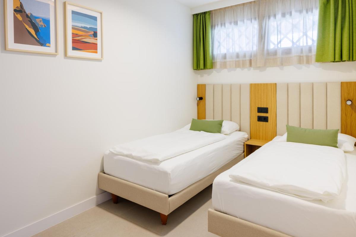 Cama o camas de una habitación en Hapimag San Agustín