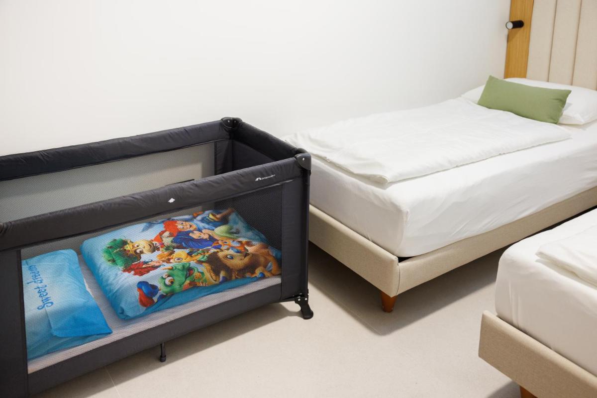 Cama o camas de una habitación en Hapimag San Agustín