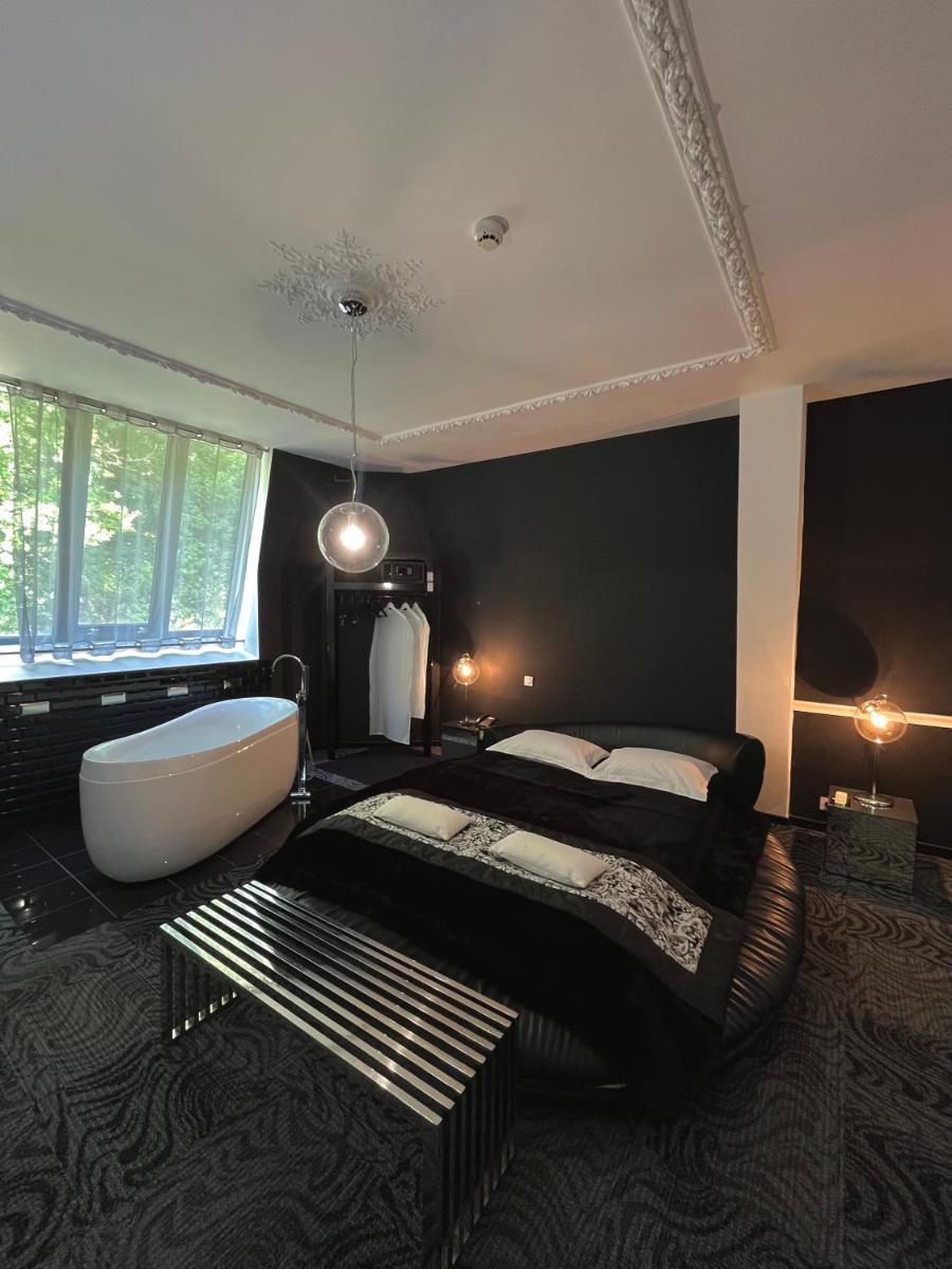 Un ou plusieurs lits dans un hébergement de l'établissement Art Hotel
