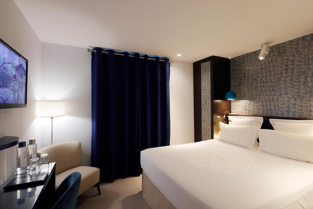 Un ou plusieurs lits dans un hébergement de l'établissement Hotel Eden