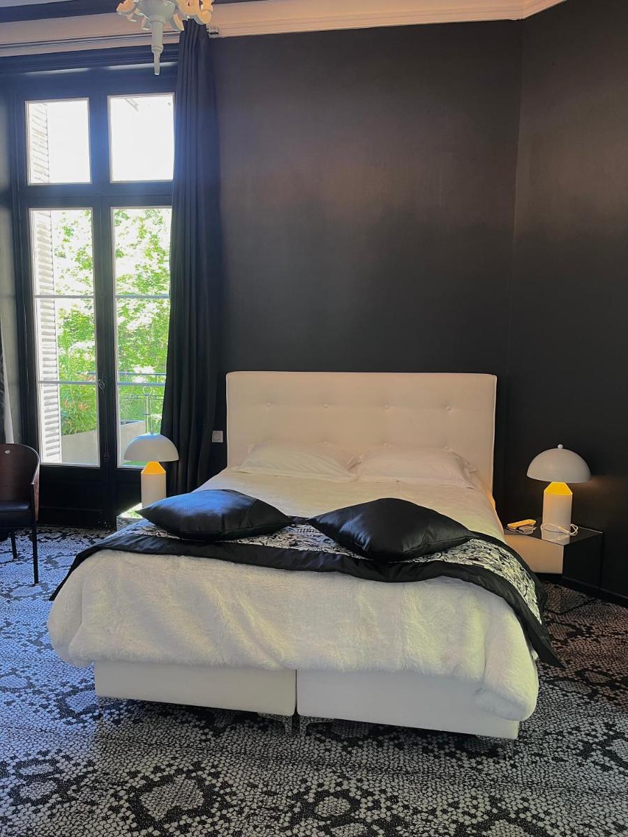 Un ou plusieurs lits dans un hébergement de l'établissement Art Hotel