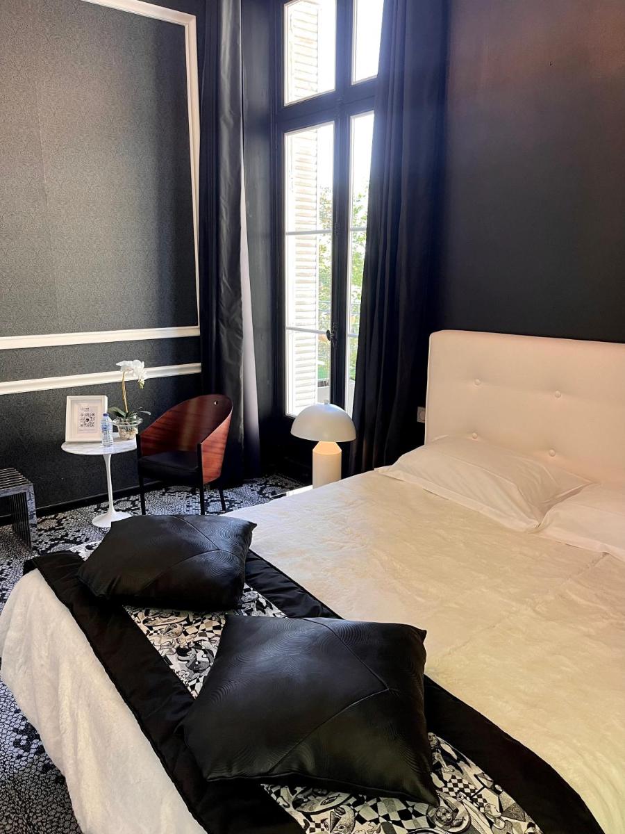 Un ou plusieurs lits dans un hébergement de l'établissement Art Hotel