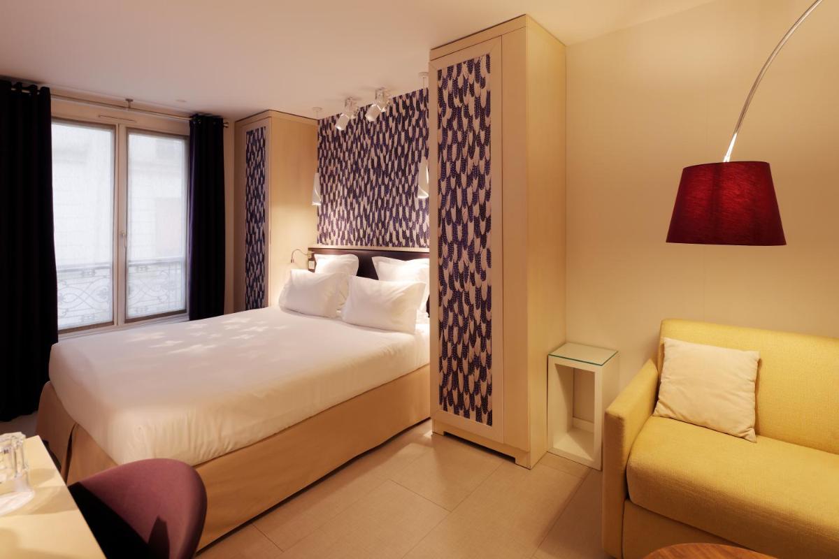 Un ou plusieurs lits dans un hébergement de l'établissement Hotel Eden