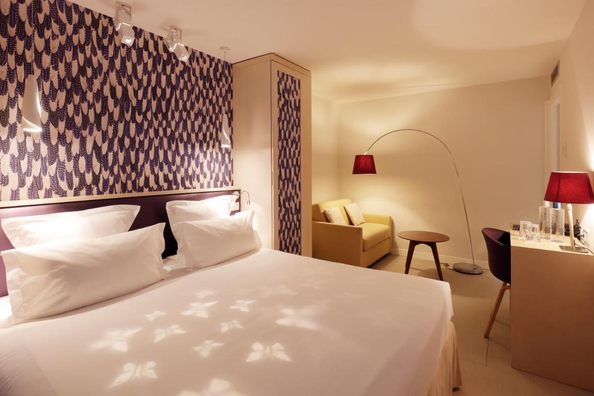 Un ou plusieurs lits dans un hébergement de l'établissement Hotel Eden