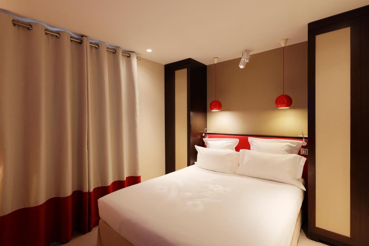 Un ou plusieurs lits dans un hébergement de l'établissement Hotel Eden