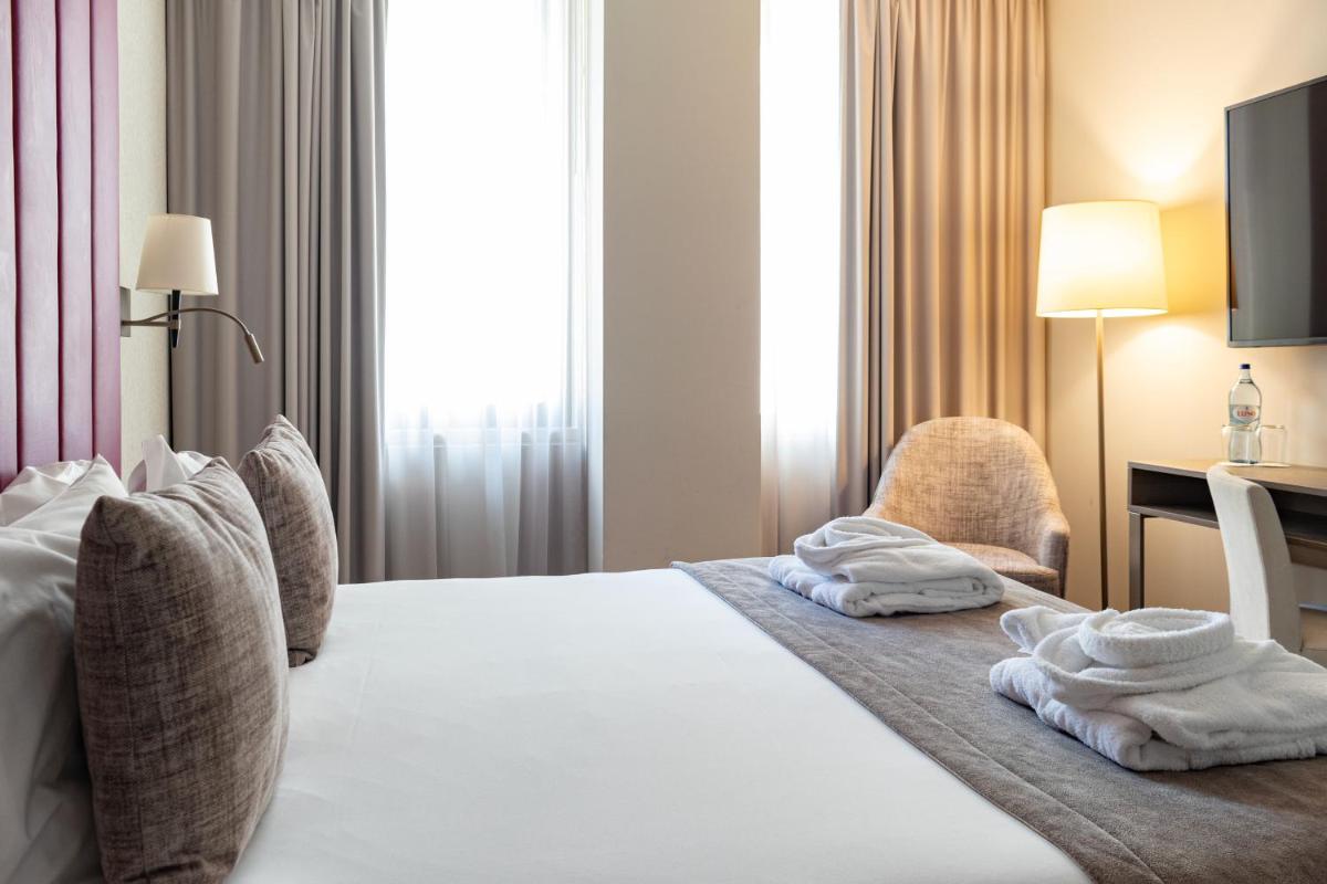 Uma cama ou camas num quarto em MASA Hotel & Spa Campo Grande Collection