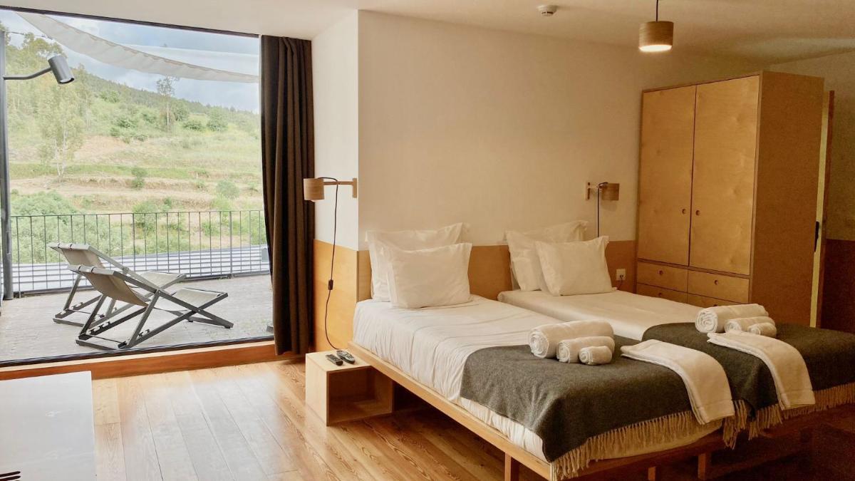 Uma cama ou camas num quarto em Colmeal Countryside Hotel