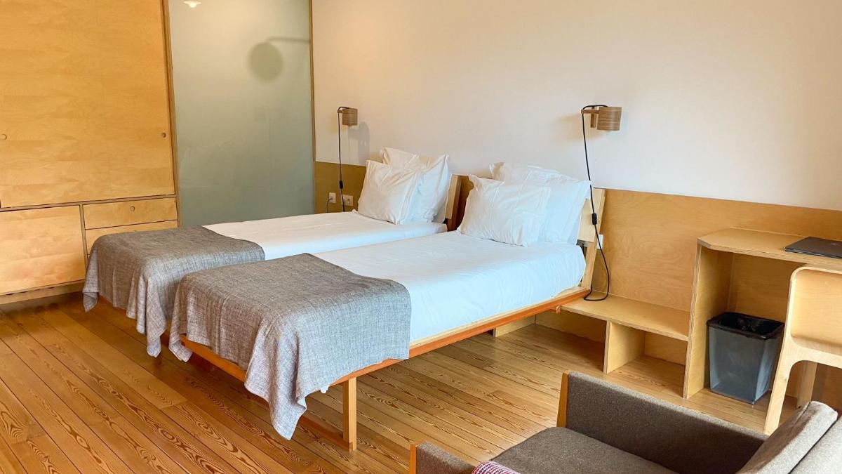Uma cama ou camas num quarto em Colmeal Countryside Hotel