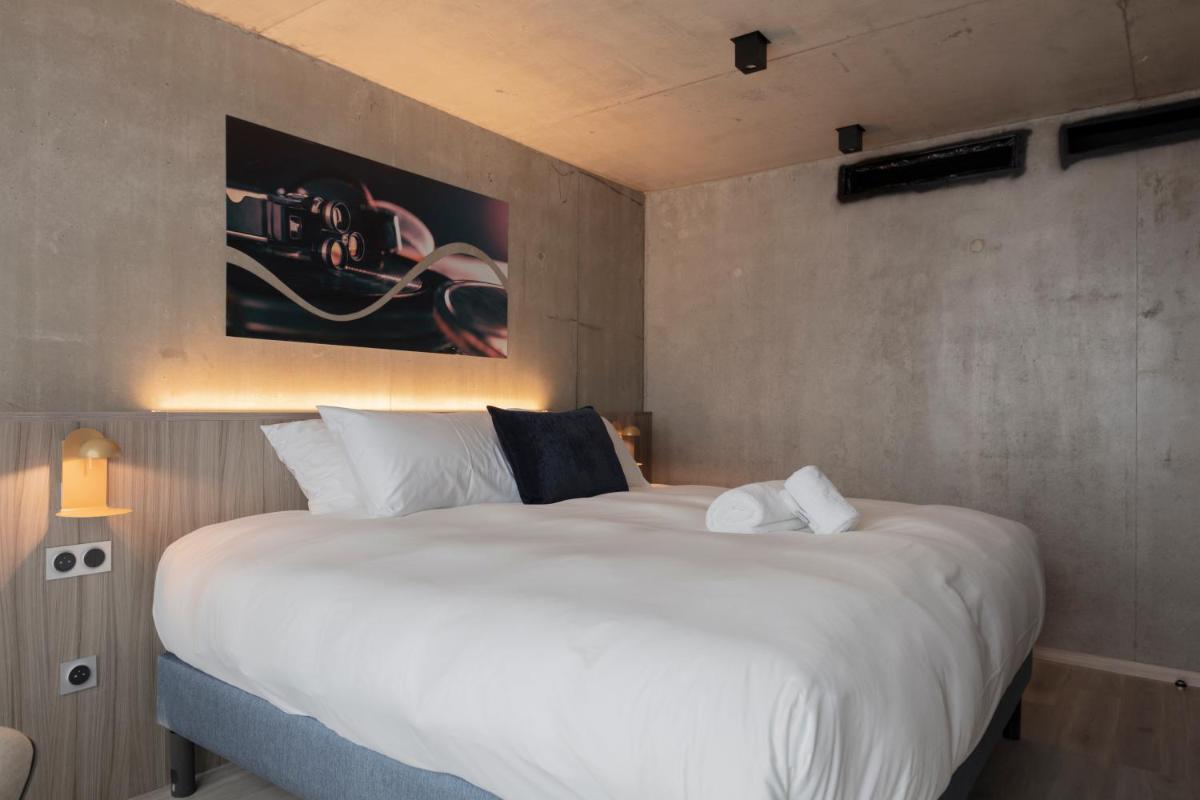 Un ou plusieurs lits dans un hébergement de l'établissement Ki Space Hotel & Spa - near Disneyland Paris