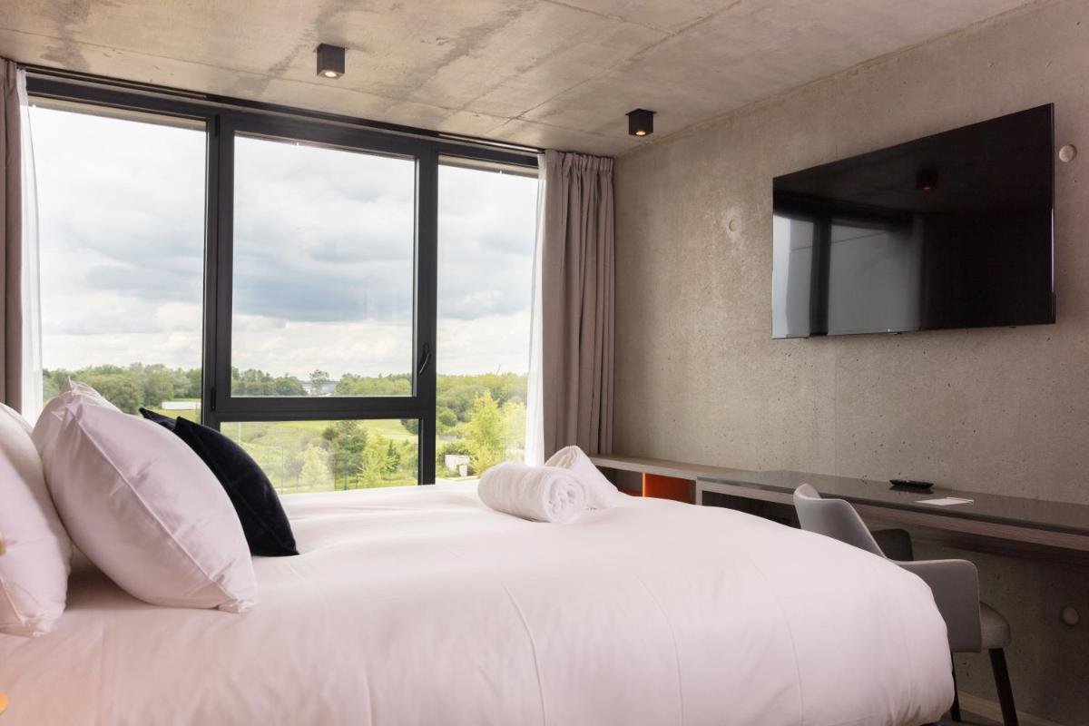 Un ou plusieurs lits dans un hébergement de l'établissement Ki Space Hotel & Spa - near Disneyland Paris