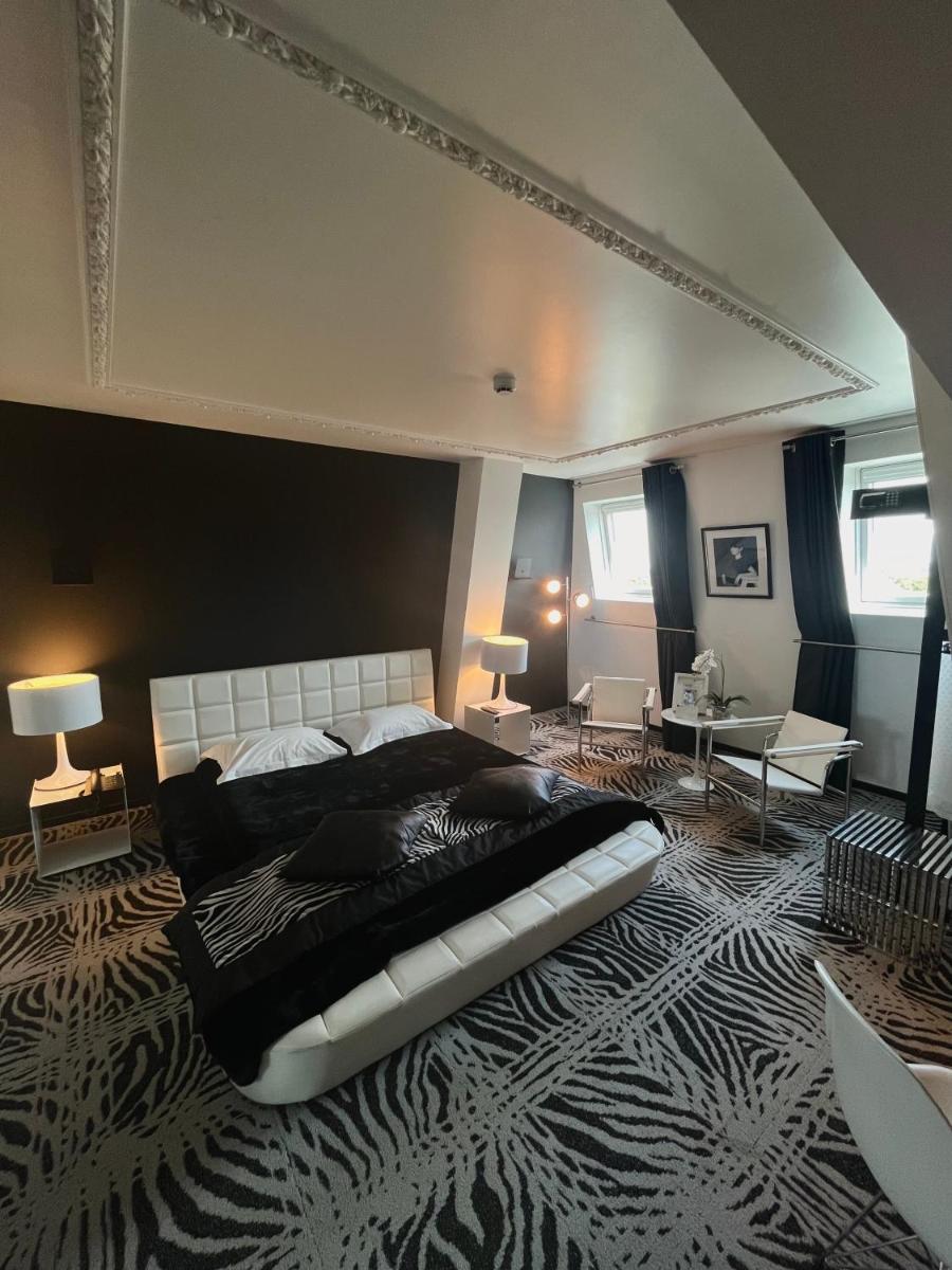 Un ou plusieurs lits dans un hébergement de l'établissement Art Hotel