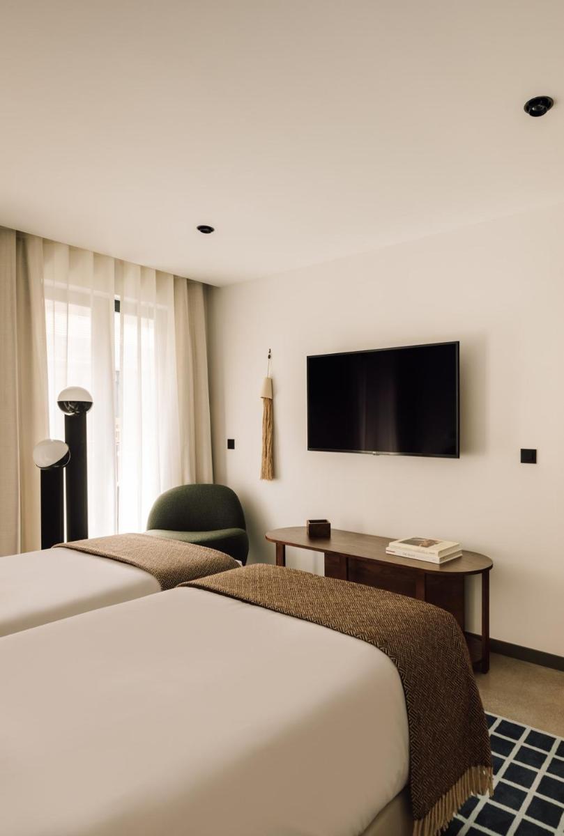 Uma cama ou camas num quarto em The Rebello Hotel & Spa - Small Luxury Hotels Of The World