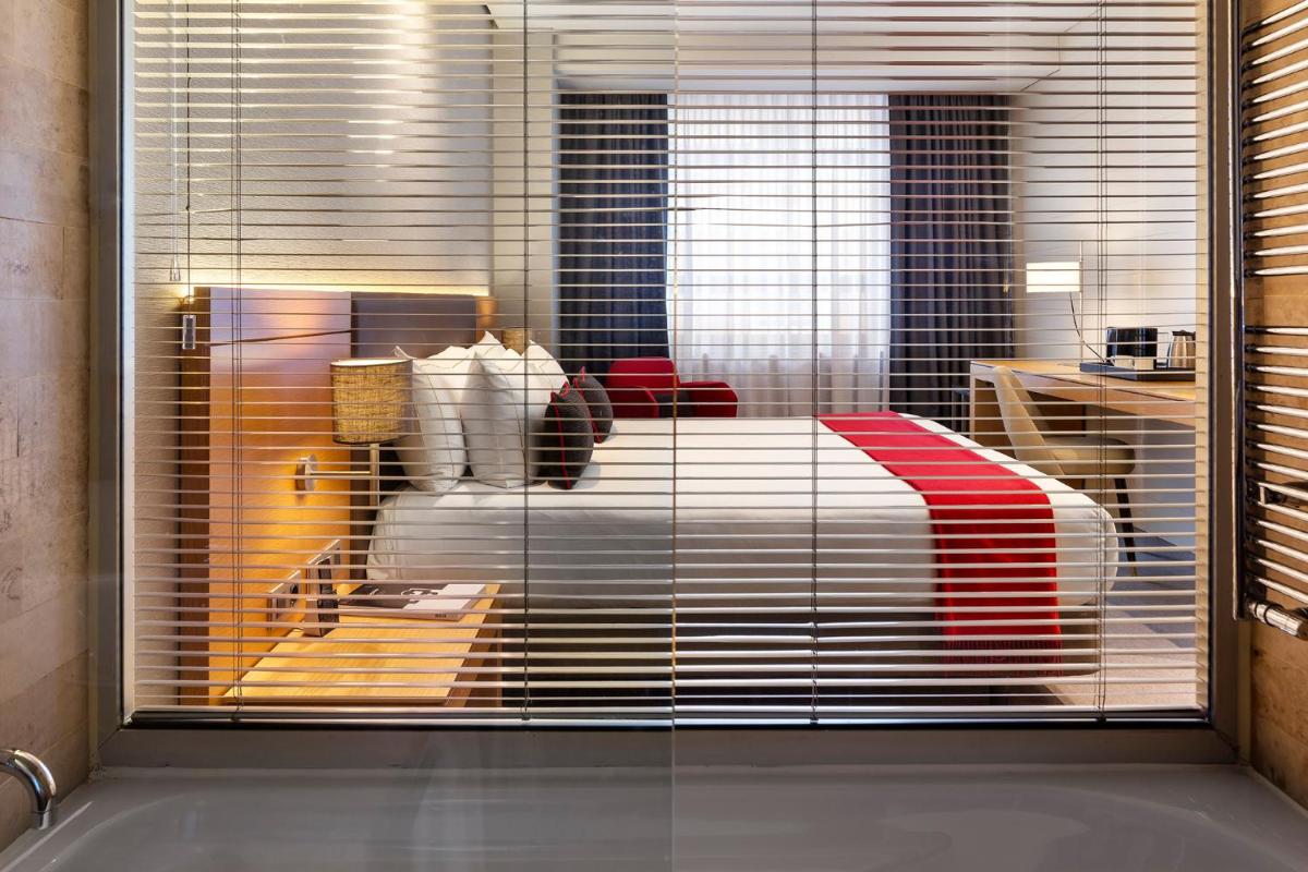 Cama o camas de una habitación en The Artist Grand Hotel of Art
