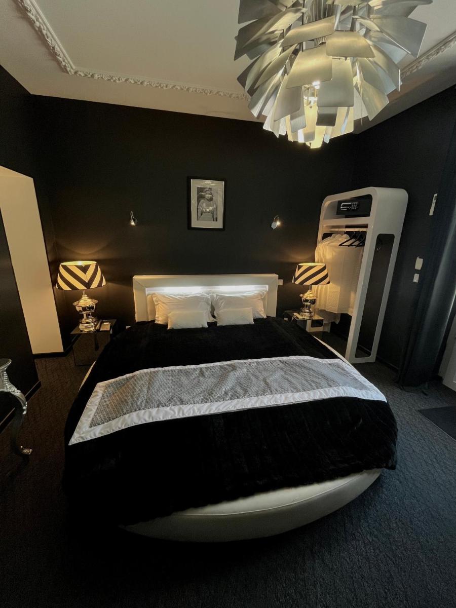 Un ou plusieurs lits dans un hébergement de l'établissement Art Hotel