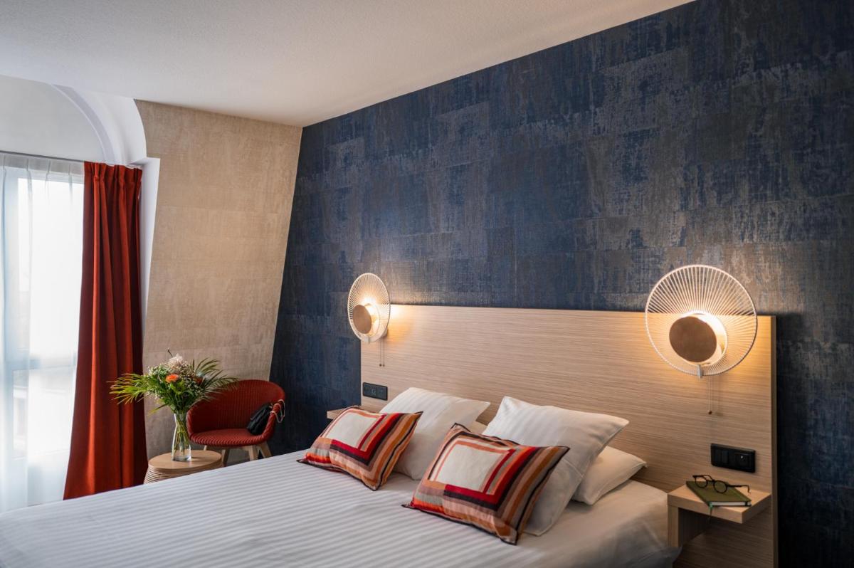 Un ou plusieurs lits dans un hébergement de l'établissement Hôtel L'Escale Marine Valdys Resort & SPA