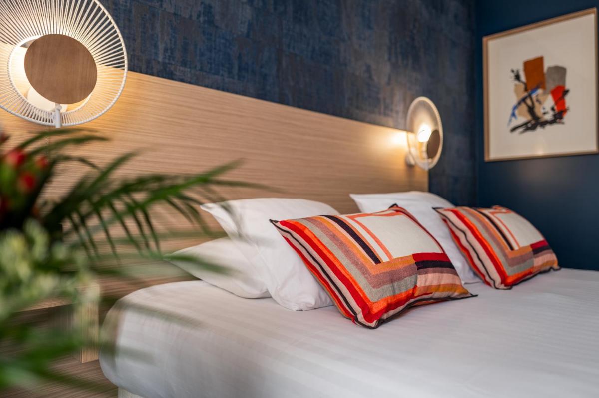 Un ou plusieurs lits dans un hébergement de l'établissement Hôtel L'Escale Marine Valdys Resort & SPA
