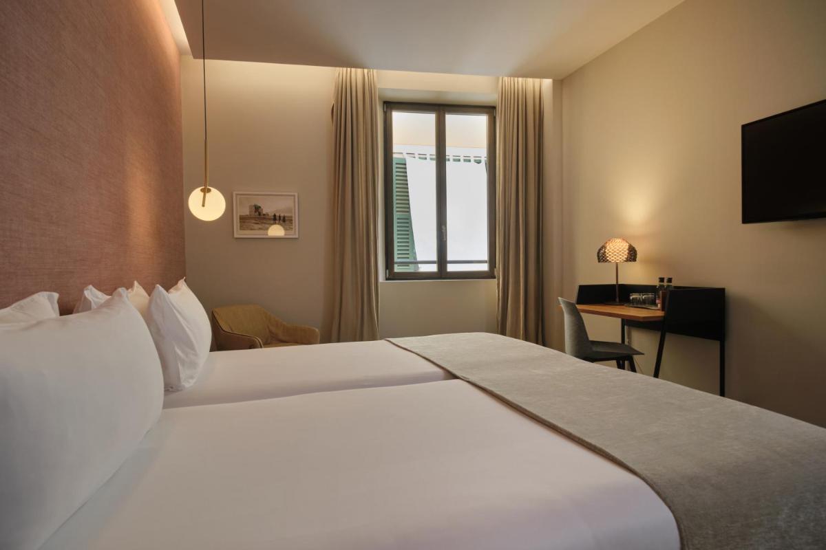 Cama o camas de una habitación en Sant Jaume Design Hotel