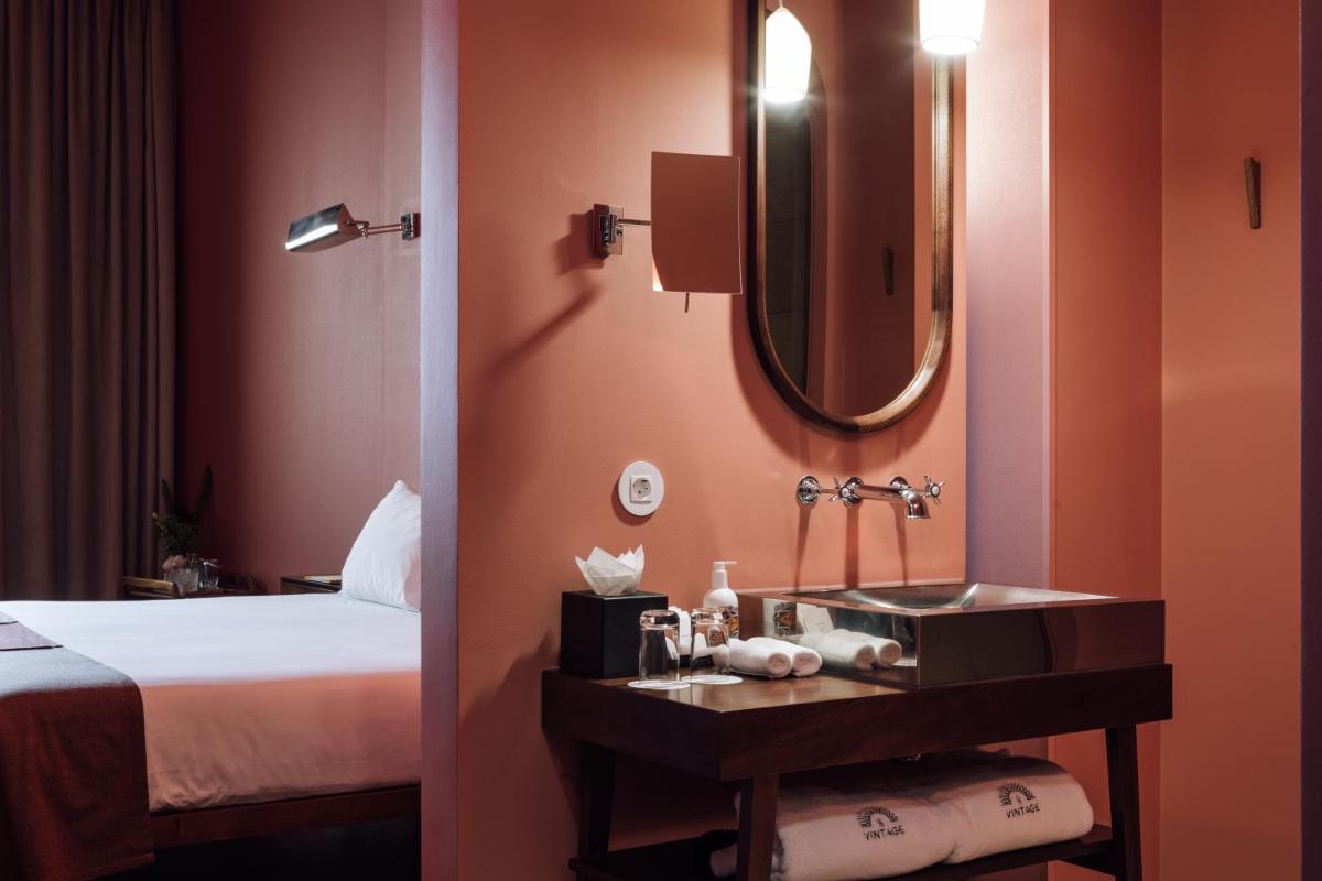 Uma cama ou camas num quarto em The Vintage Hotel & Spa Lisbon