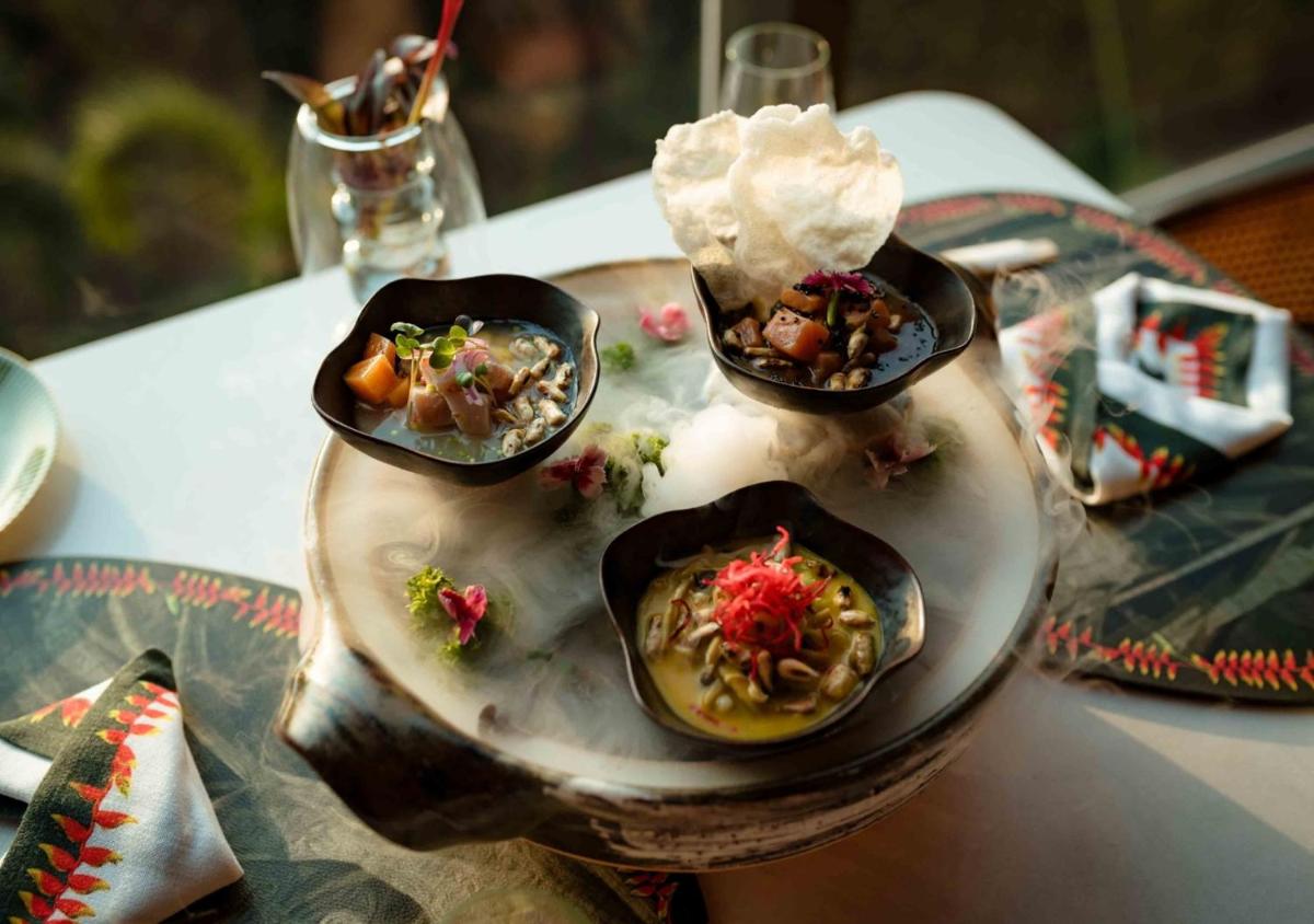 a table topped with four bowls of food on a table at JW Marriott Goa in Vagator a table topped with four bowls of food on a table at JW Marriott Goa in Vagator