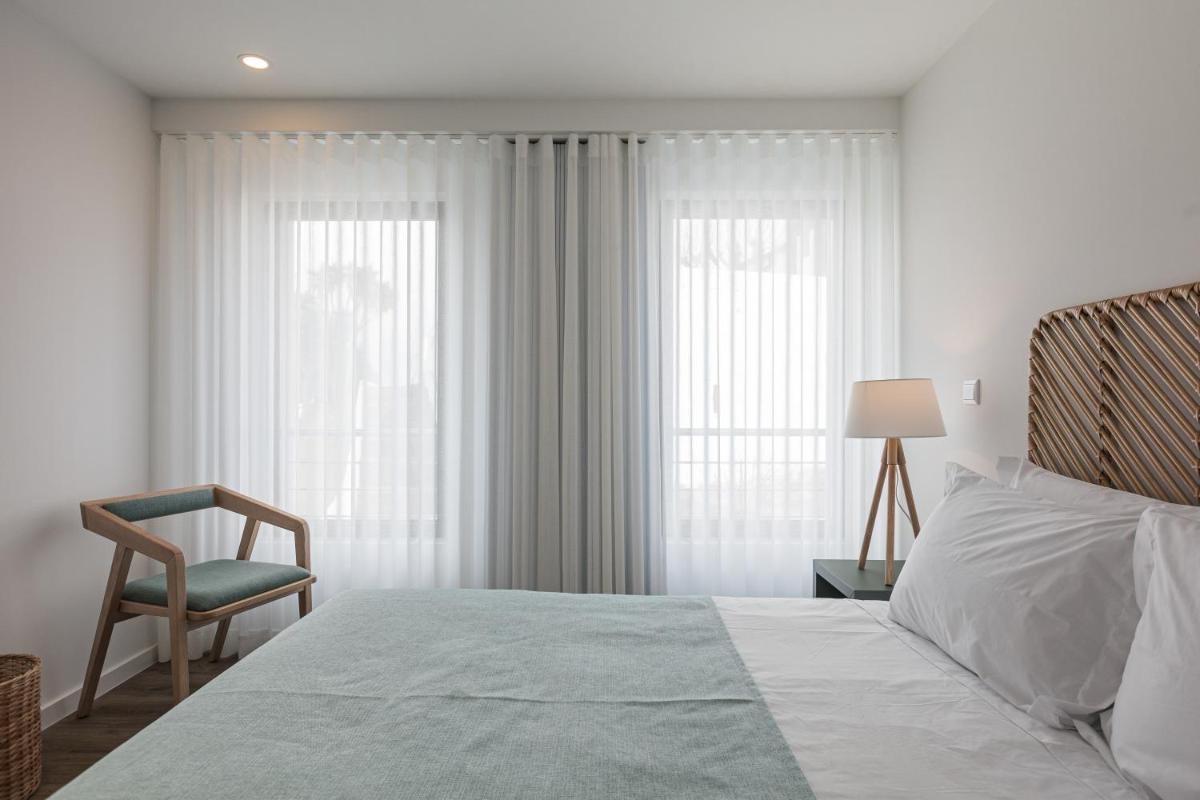 Uma cama ou camas num quarto em Alto do Forte