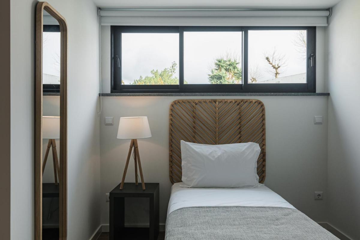 Uma cama ou camas num quarto em Alto do Forte