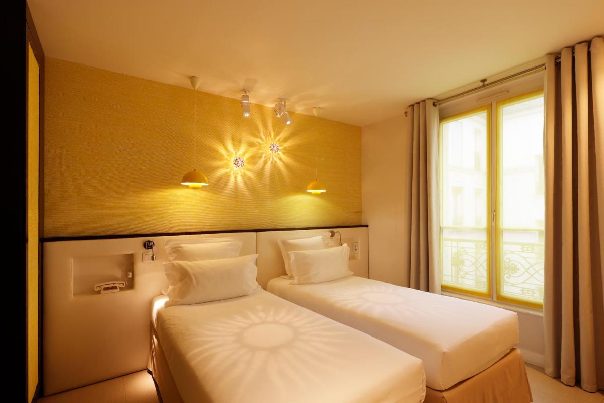Un ou plusieurs lits dans un hébergement de l'établissement Hotel Eden