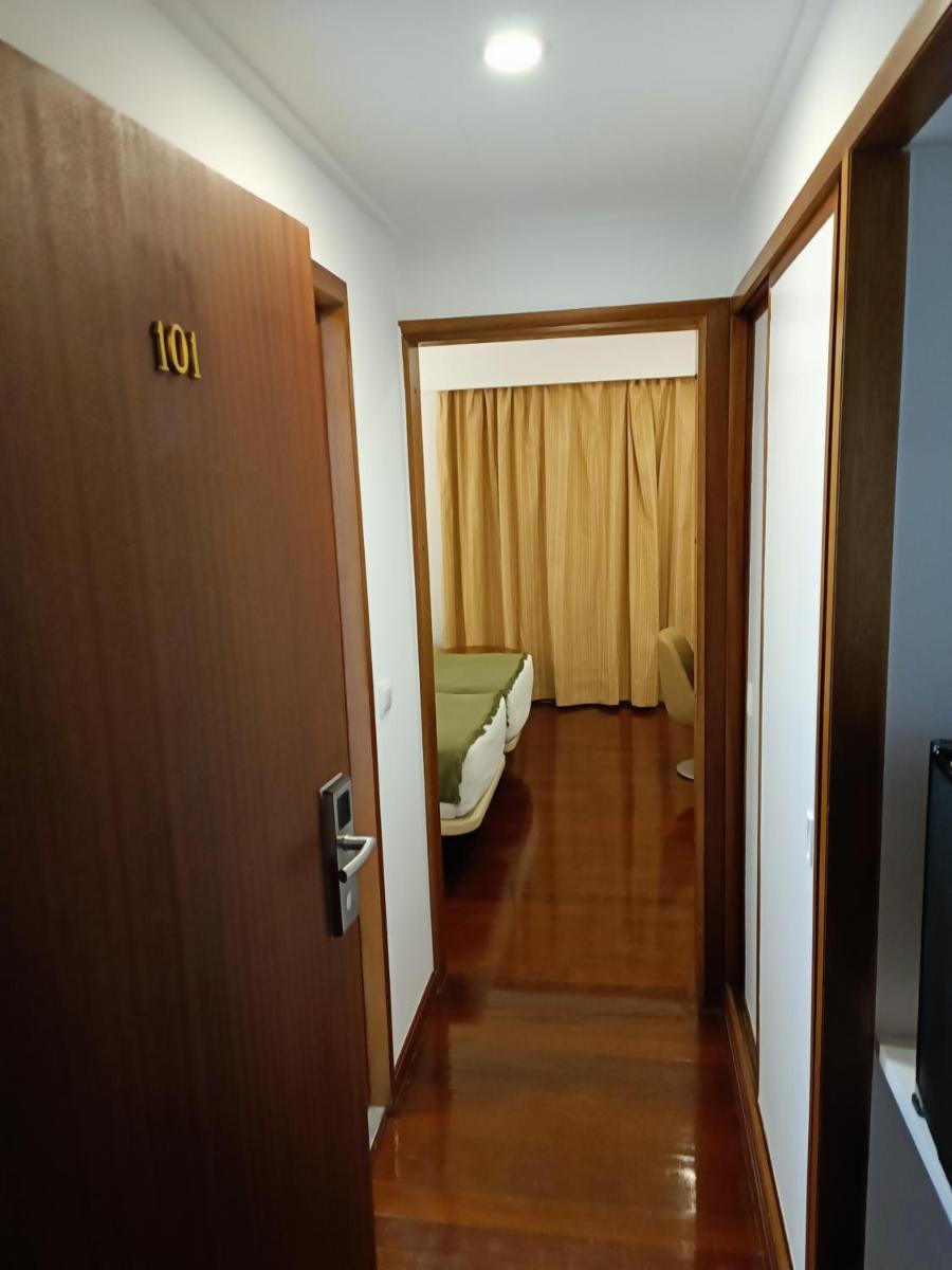 Uma cama ou camas num quarto em Hotel Porto Santo & Spa