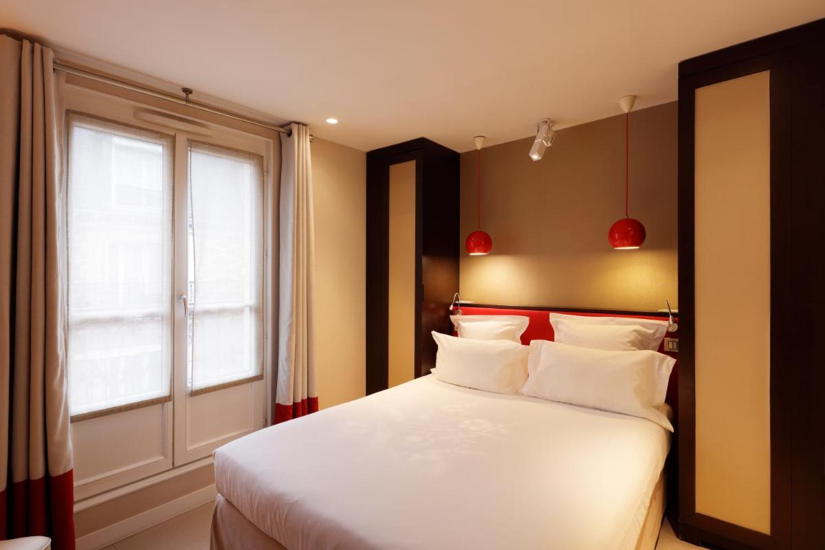 Un ou plusieurs lits dans un hébergement de l'établissement Hotel Eden