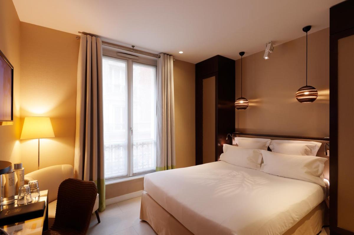 Un ou plusieurs lits dans un hébergement de l'établissement Hotel Eden
