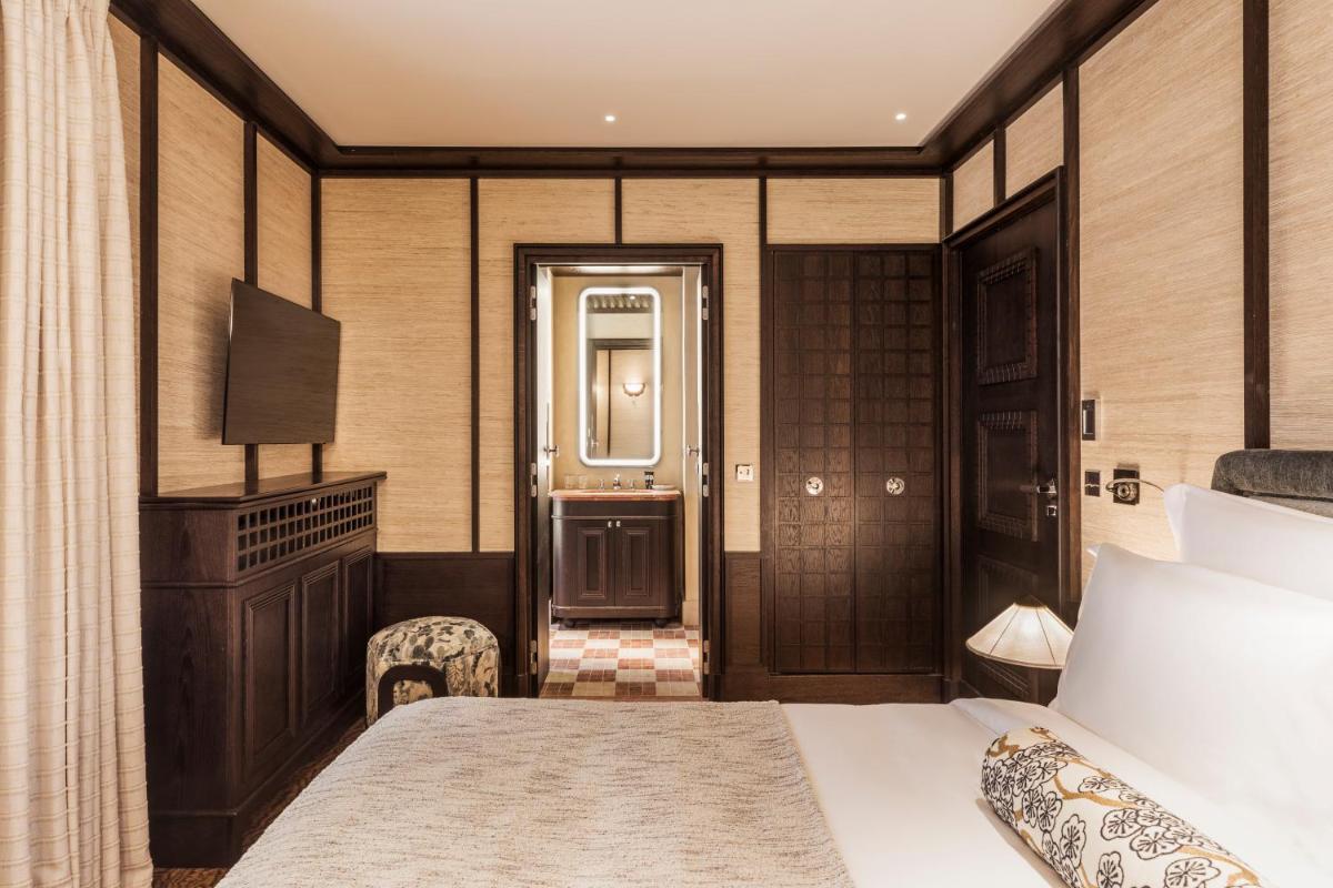 Un ou plusieurs lits dans un hébergement de l'établissement Hotel Hana