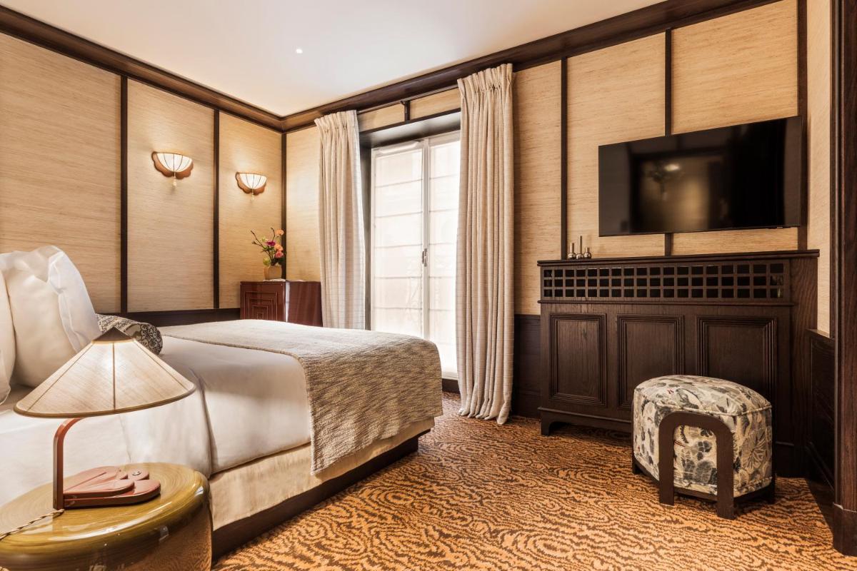 Un ou plusieurs lits dans un hébergement de l'établissement Hotel Hana