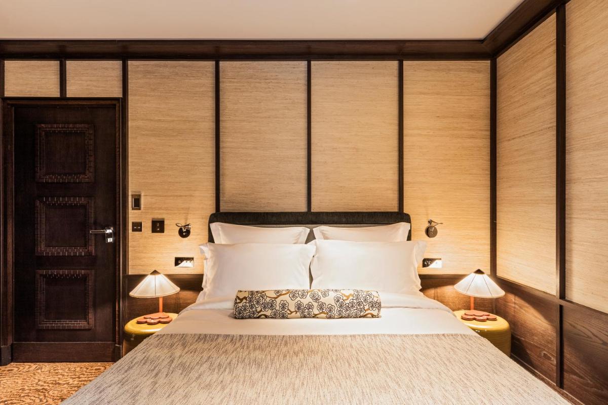 Un ou plusieurs lits dans un hébergement de l'établissement Hotel Hana