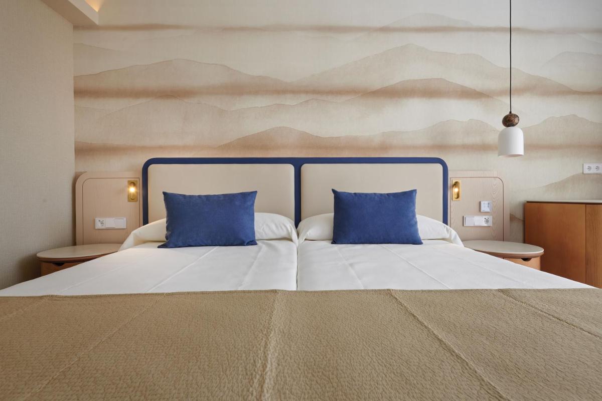 Cama o camas de una habitación en Hipotels Flamenco