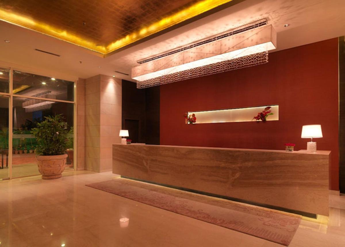 a lobby with a reception desk in a building at Hotel Royal Orchid Jaipur, Tonk Road in Jaipur