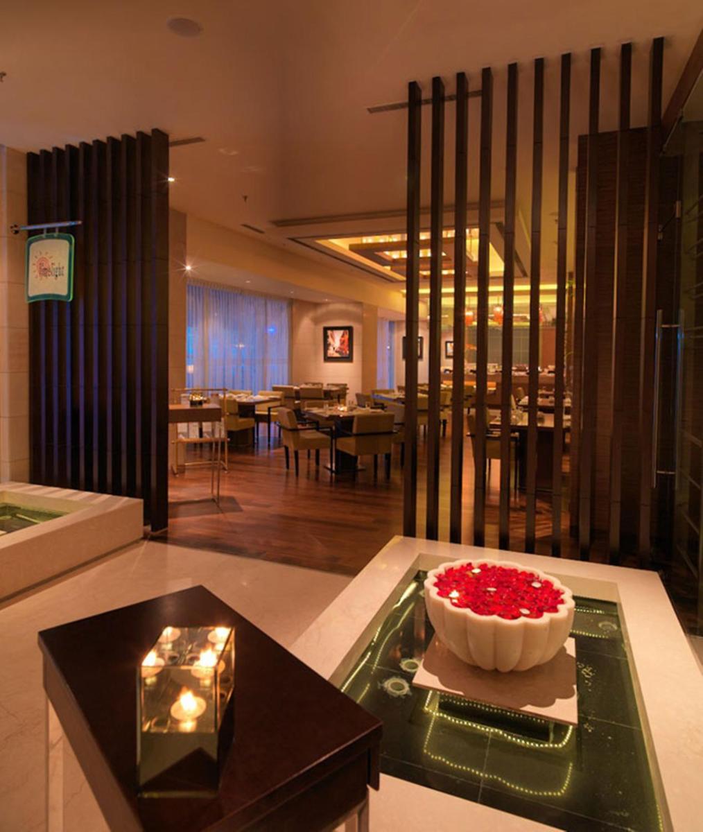 a living room with a cake on a table at Hotel Royal Orchid Jaipur, Tonk Road in Jaipur