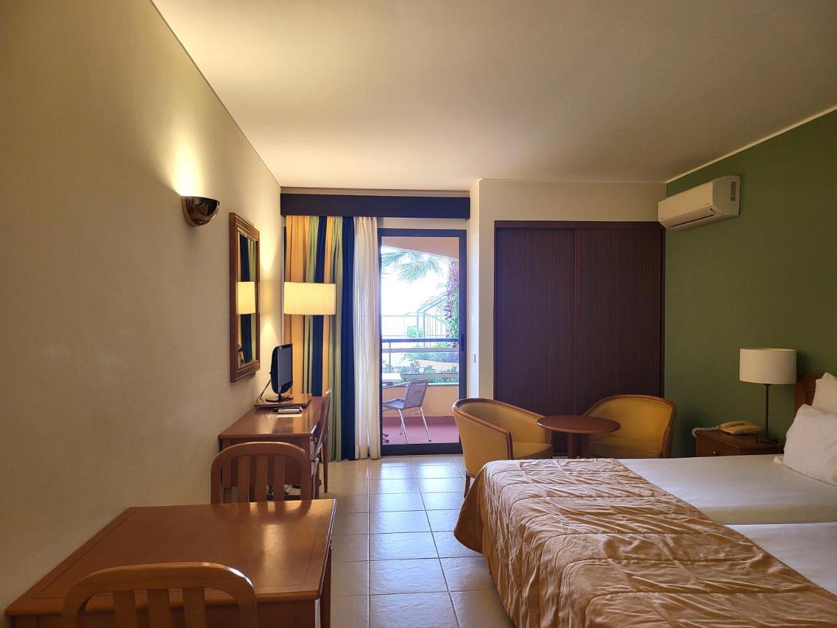 Uma cama ou camas num quarto em Hotel Cais da Oliveira