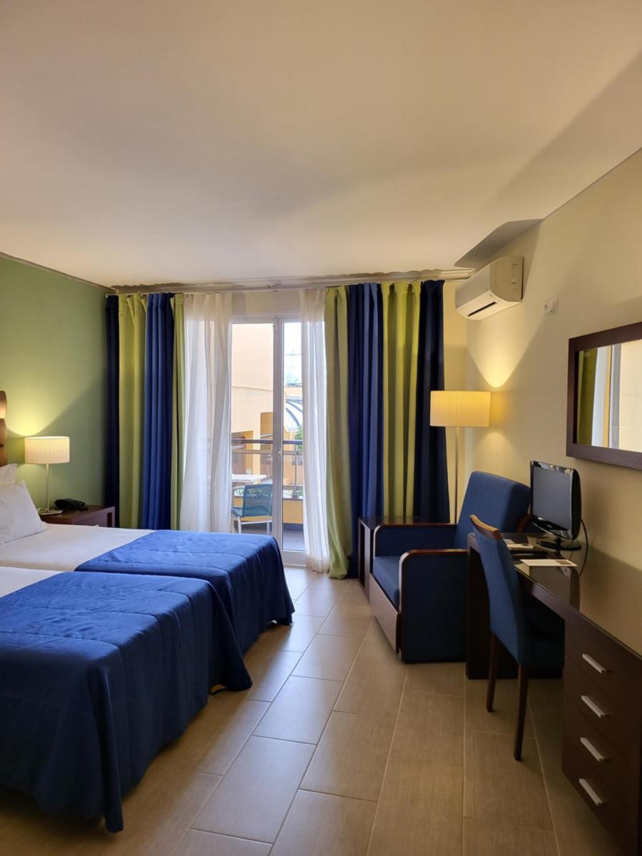 Uma cama ou camas num quarto em Hotel Cais da Oliveira
