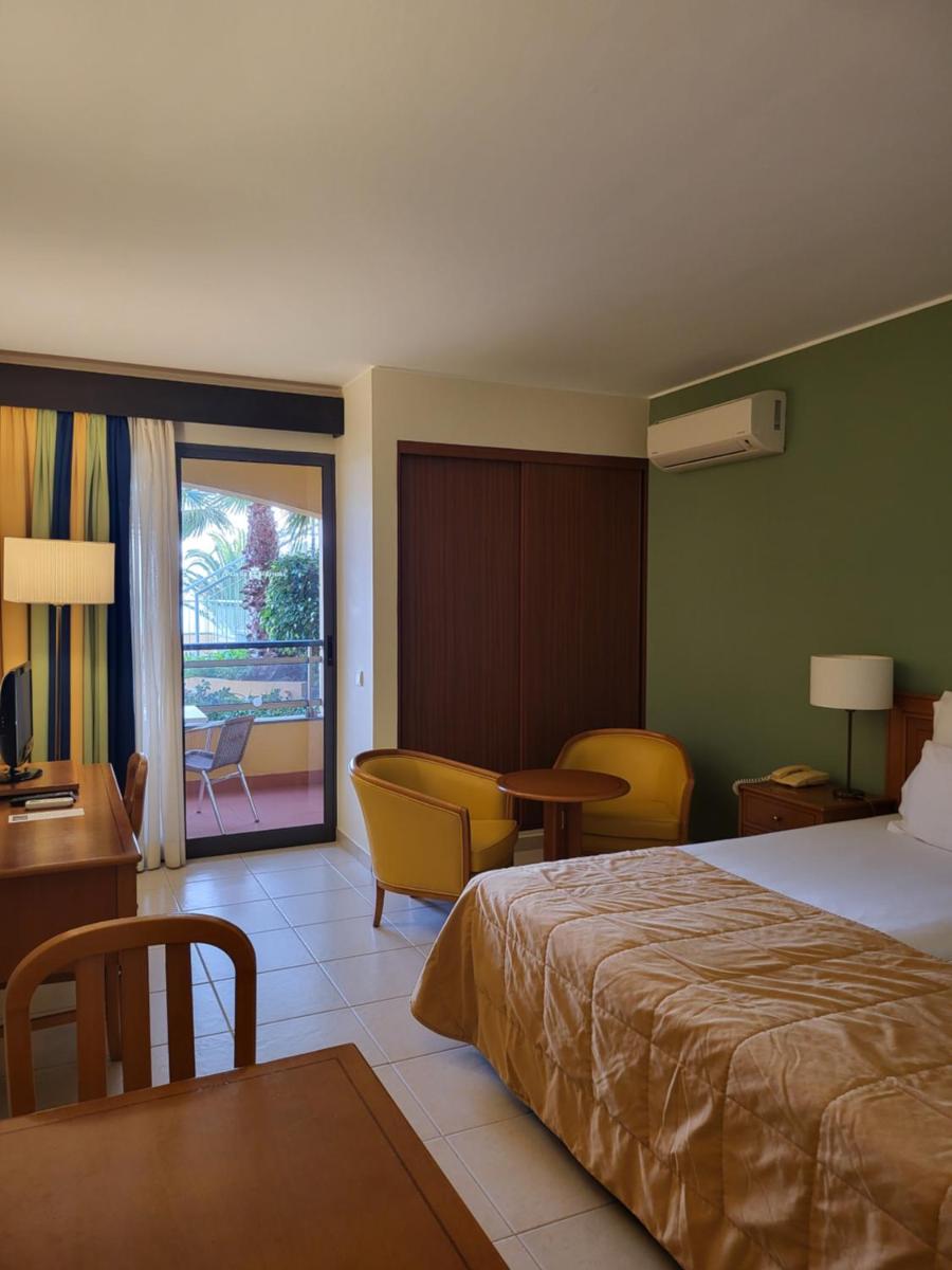 Uma cama ou camas num quarto em Hotel Cais da Oliveira